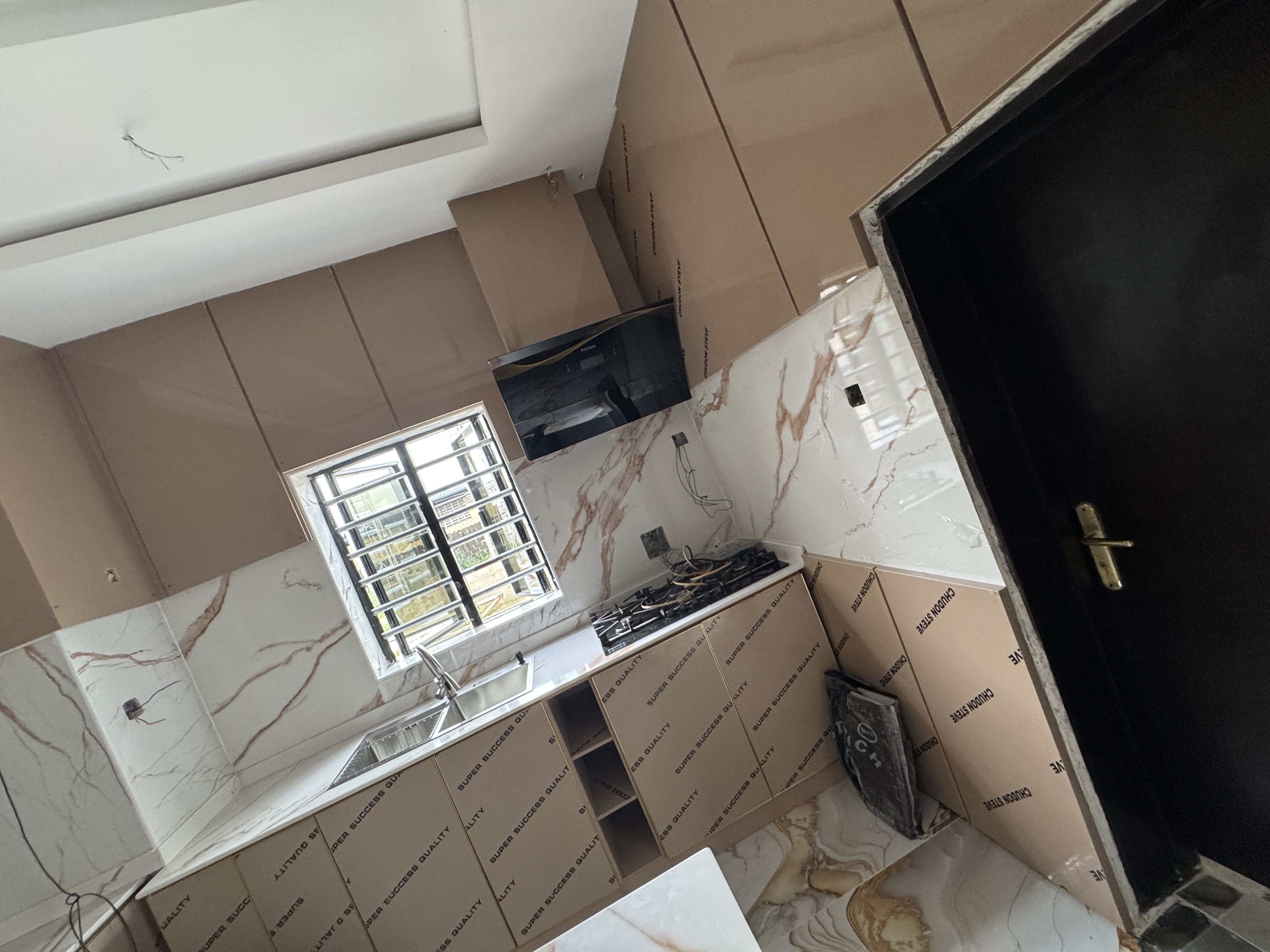 Side perspective of modern kitchen counter layouts with integrated stove top burners and minimalist accent lighting fixtures